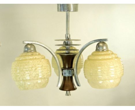 CEILING LIGHT. A three branch ceiling light fitting with cream marbled glass shades on an Art Deco design chrome & wood fitti
