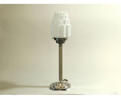 CHROME TABLE LAMP. A chromed table lamp with white glass shade. Push button switch. Height 49cm. Note: Some of these lamps ma