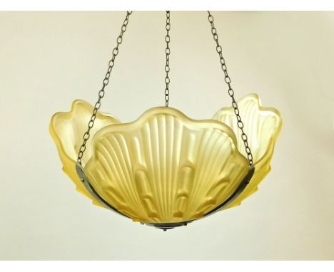 CLAM SHELL SHADE. A lemon yellow frosted glass light shade of three-section clam shell design in chromed frame.Condition: No 