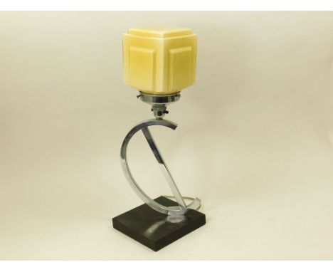 CHROME TABLE LAMP. A chromed table lamp with yellow glass shade. Ebonised base. Push button switch. Height 47cm. Note: Some o