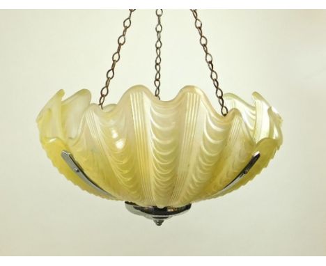 CLAM SHELL SHADE. A frosted glass light shade of three-section clam shell design in chromed frame. Sprayed painted light yell