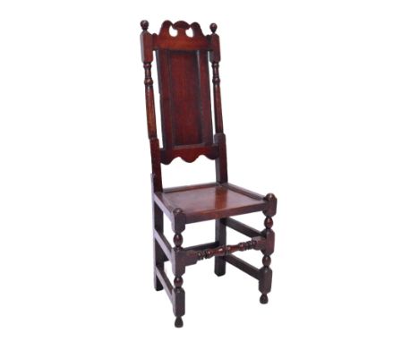 A late 18th century oak backed stool with ring turned sides and stretchered legs, height 121cm. CONDITION REPORT: There is an