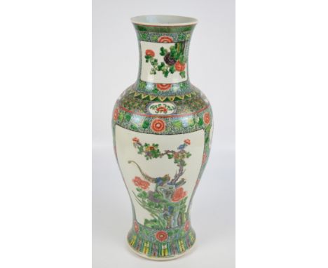 A large 20th century Chinese porcelain baluster vase painted in enamels with two main opposing rectangular panels depicting b