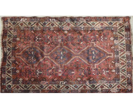 A red ground Qashqai carpet, 210cm x 165cm.