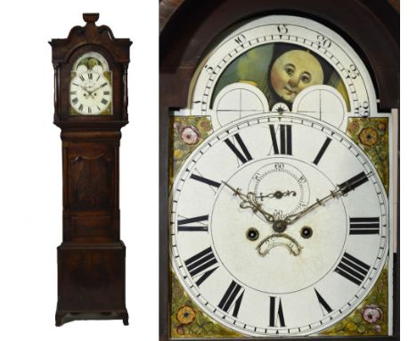 An early 19th century mahogany eight day longcase clock with broken swan neck pediment above moon phase enamel dial set with 