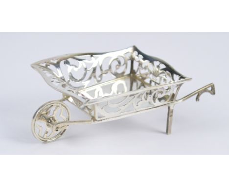 HENRY MATTHEWS; a George V hallmarked silver bonbon dish modelled as a wheelbarrow with pierced foliate scroll sides, Birming