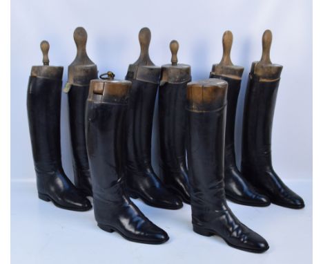 Four pairs of lady's vintage black leather riding boots, each complete with wooden shoe trees (one ring loop attachment missi
