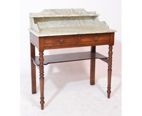 An Edwardian marble and mahogany wash stand, green and white marble top with single shelf to the splashback, supported on two