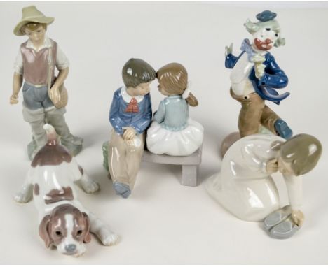 Three Lladro figures; girl with slippers, puppy and fishing boy (af) and two Nao figures (5). CONDITION REPORT: Fishing boy h