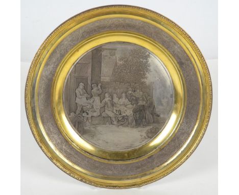 A late 19th century French electroplated and partly gilt circular plate cast and engraved with "Prodigal Son" scene after Ten