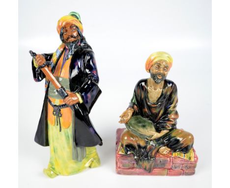 Two Royal Doulton figures; HN1365 "The Mendicant" and HN2105 "Bluebeard" (2). CONDITION REPORT: These are first quality piece