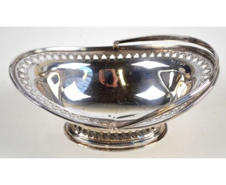 ATKIN BROS; a late Victorian hallmarked silver swing handle oval basket with pierced rim, length 15.5cm, Sheffield 1900, appr