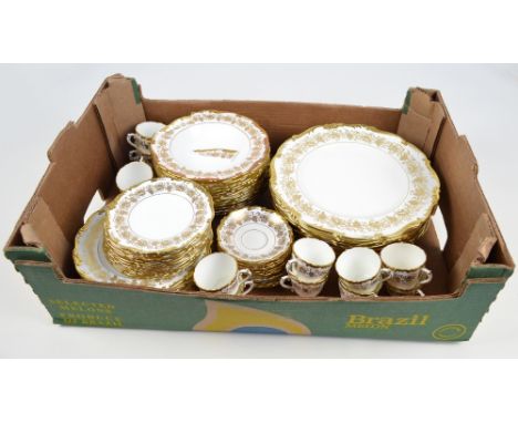 A quantity of Coalport dinnerware in "Hazelton" gold and white pattern comprising twelve dinner plates, twelve dessert plates