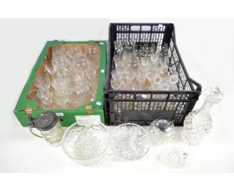 A collection of clear cut glassware including various sets and part sets of drinking glasses, a decanter and a biscuit barrel