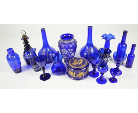 A quantity of blue glass items, to include a pair of Victorian bottle vases decorated with birds and flowers, a baluster vase