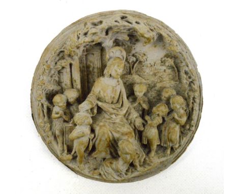 A decorative carved tondo depicting Jesus teaching children with architectural landscape in the background, diameter 12.5cm (