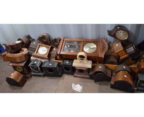 A large quantity of mantel clocks and clock parts for restoration, many case only, also a 1940s wall clock, etc.