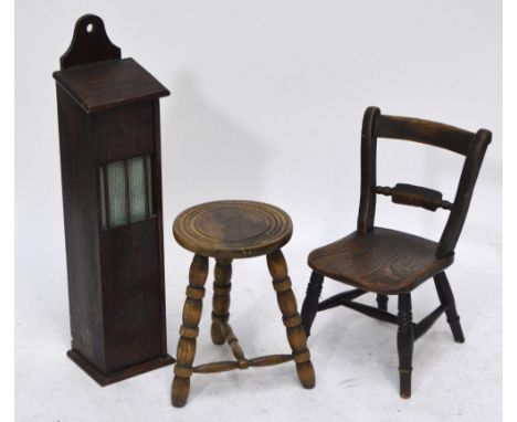 A stained pine baguette box with hinged lid and wall suspension, height 85 cm, a stool on three bobbin turned stretcher suppo