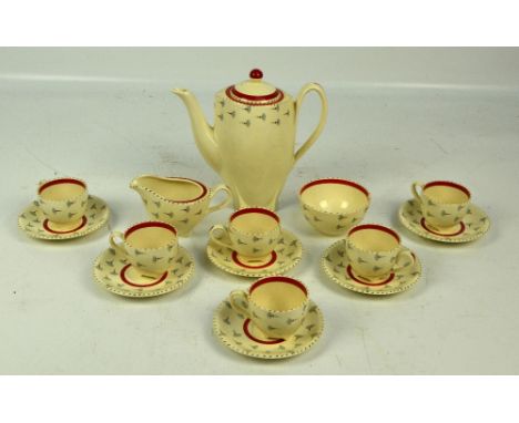 A 1950s Burleigh Ware coffee service decorated with dandelion seed heads and red banding. CONDITION REPORT: There is a rim ch