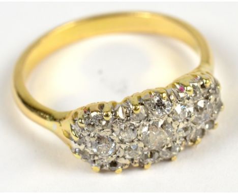 A yellow metal and diamond ring, the largest of numerous pave set stones, approx 0.2cts, size Q, approx 4.5g.