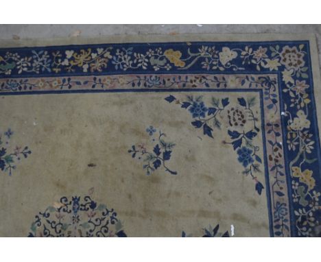 A large cream ground Chinese Superwash carpet, 325cm x 280cm.