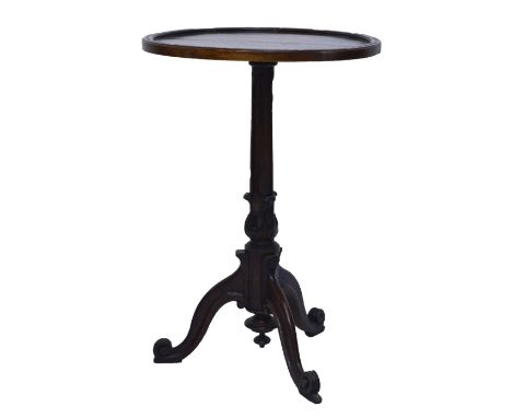 A Victorian oak tripod occasional table.