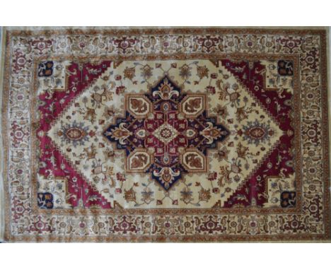 A beige ground Heriz carpet, 280cm x 200cm.