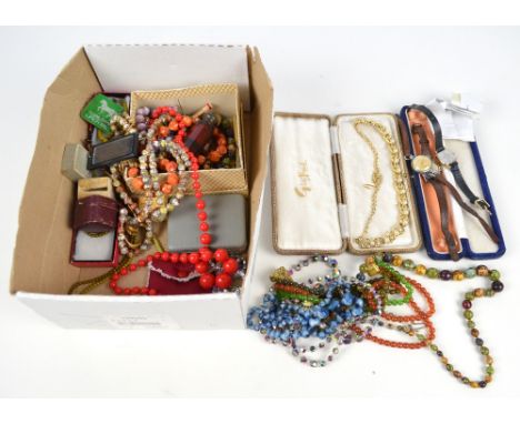 A group of costume jewellery including predominantly various bead necklaces, also a white metal mounted cut ruby glass double