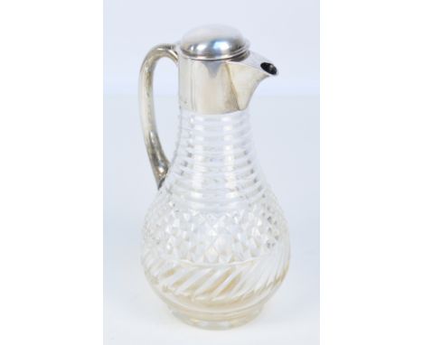HUKIN & HEATH; a late Victorian hallmarked silver mounted cut glass claret jug of bulbous form with plain handle, London 1898