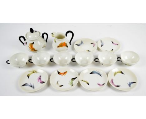 A Limoges feather decorated hand painted part tea service, signed to base "L. Chamberlain". CONDITION REPORT: In good conditi