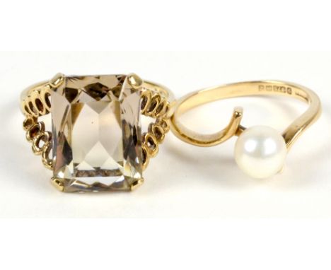 A 9ct yellow gold brown quartz ring, the radiant cut stone in high gloss setting, size M, and a further 9ct gold ring set wit