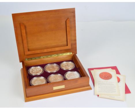 A cased set of six silver proof Great Seals of the Realm coins, with certificate of authenticity no.0082, each coin with a sp