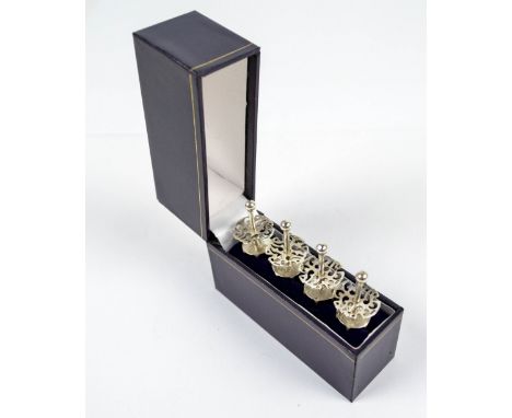 WARD BROS; two pairs of Elizabeth II hallmarked silver corn cob holders with pierced decoration and bowl finials, Birmingham 