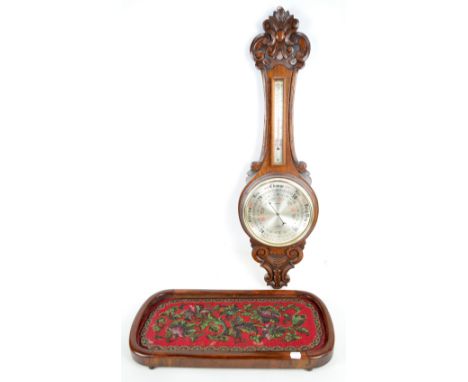 An early 20th century oak aneroid wheel barometer (af), and a Victorian walnut and bead work rounded rectangular stand (2).