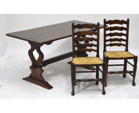 A set of four reproduction oak ladder back rush seated chairs with stretchered supports, and an oak refectory table, 153 x 75