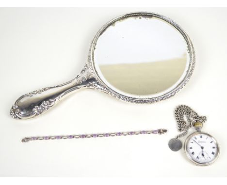A silver backed hand mirror, a silver open face crown wind pocket watch on chain and a silver bracelet (3). CONDITION REPORT: