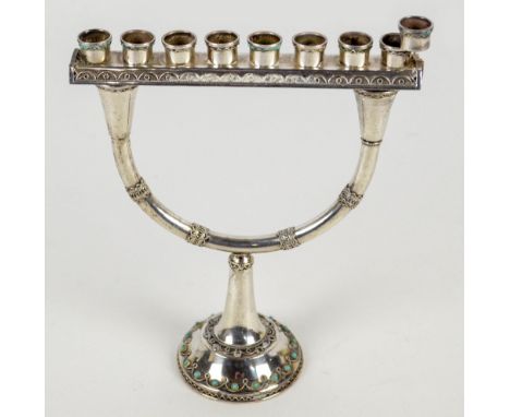 A 1960s Israeli silver Hanukkah menorah/two branch candlestick, the U-shaped twin branches supporting a bar with eight sconce
