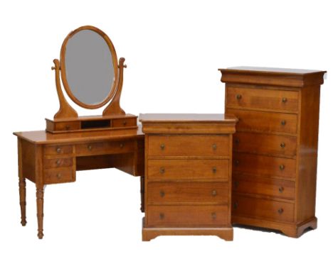 A three piece cherrywood bedroom suite comprising a tallboy with cushion moulded drawer above six further drawers, a dressing