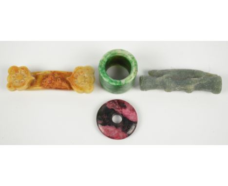 A Chinese green hardstone archers ring, with pink and black quartz bi-disc, diameter 3.5cm and a carved button hook, also a g