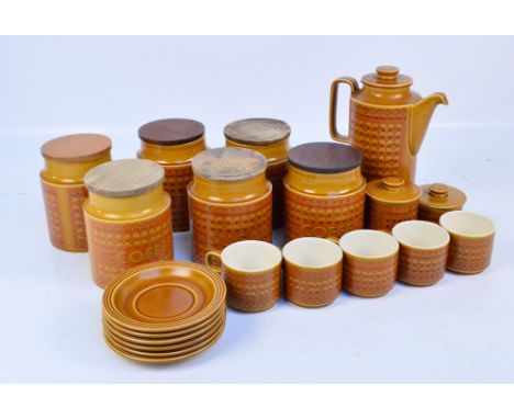 A Hornsea "Saffron" pattern decorated coffee set comprising five cups, six saucers, a coffee pot, two sugar boxes with covers