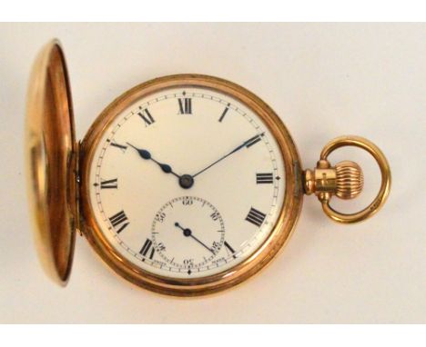 A 9ct yellow gold half hunter crown wind pocket watch, the circular dial and enamel chapter ring to cover set with Roman nume