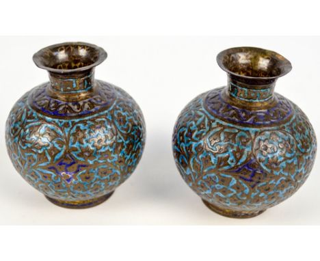 A pair of c.1900 Eastern brass globular vases with overall blue enamel heightened floral and foliate scroll decoration, each 
