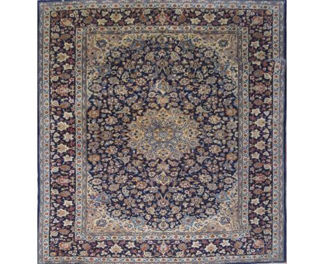 A large blue ground Persian carpet, 360cm x 290cm CONDITION REPORT: Rip to centre, approximately 10cm long some mild staining