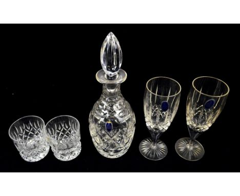 A collection of boxed Royal Doulton crystal including tumblers, stemmed drinking glasses, decanters, vase and a boxed pair of
