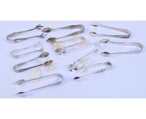 A collection of small hallmarked silver tongs comprising a bright cut pair with wrythen stems, Nathan & Hayes, Birmingham 189