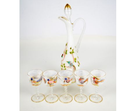 An early 20th century white opaque glass decanter and a set of five stem glasses decorated in relief with painted exotic bird