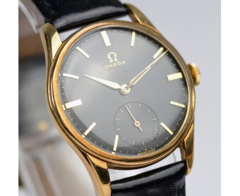 OMEGA; a gentleman's vintage 9ct gold wristwatch with black dial, subsidiary seconds hand, seventeen jewel movement no.177701