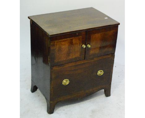 An early 19th century mahogany commode, now converted to a two door cabinet, width 62cm.