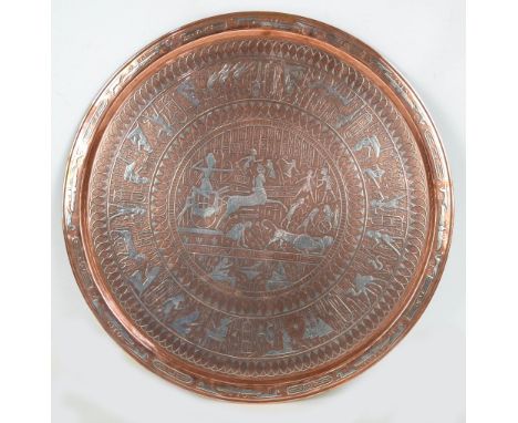 A large c.1900 Cairo ware copper circular charger/tabletop, silver inlaid with various ancient Egyptian figural scenes, diame