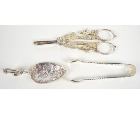 G.E WALTON & CO; a pair of Victorian hallmarked silver sugar tongs with barley twist stems and pierced engraved finials, Birm